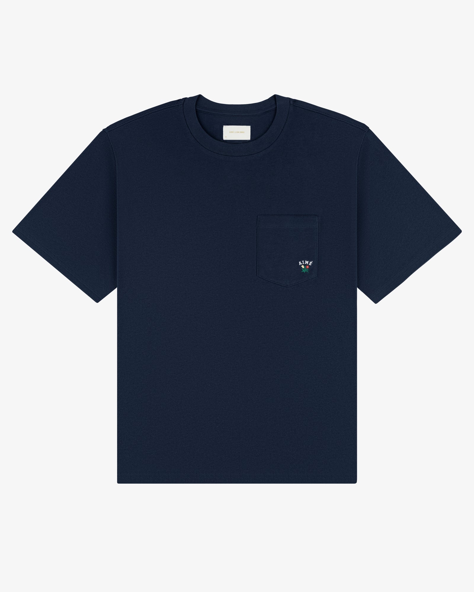 Navy Crest Pocket Tee with short sleeves, chest pocket, and small embroidered flower on the pocket.