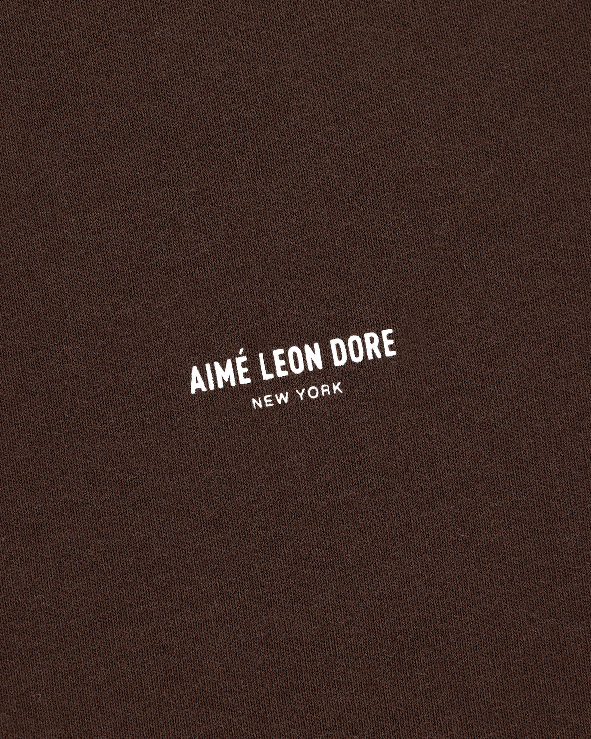 Brown Micro Logo Tee with white AIMÉ LEON DORE NEW YORK text printed at the center.
