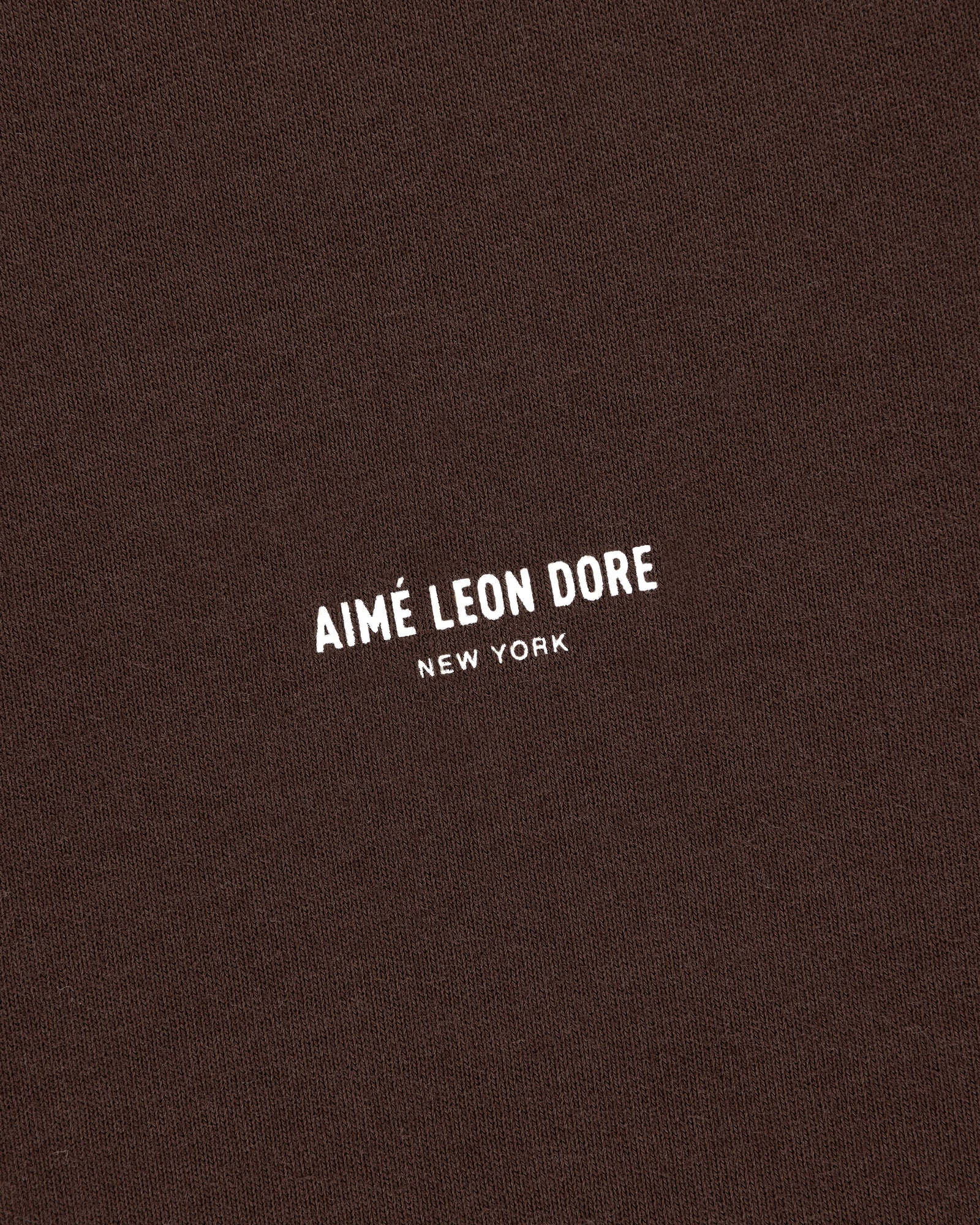 Brown Micro Logo Tee with white AIMÉ LEON DORE NEW YORK text printed at the center.