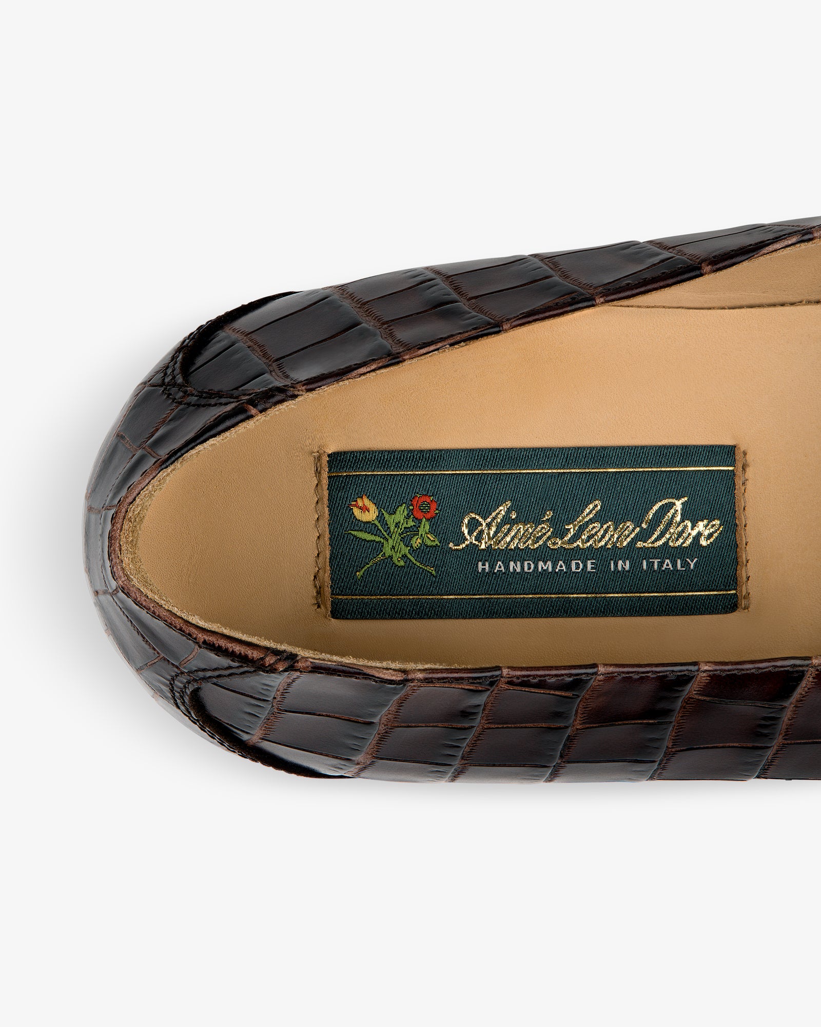 Venetian Croc Buckle Loafer: brown croc-pattern leather, tan insole, green “Aimé Leon Dore Handmade in Italy” label.