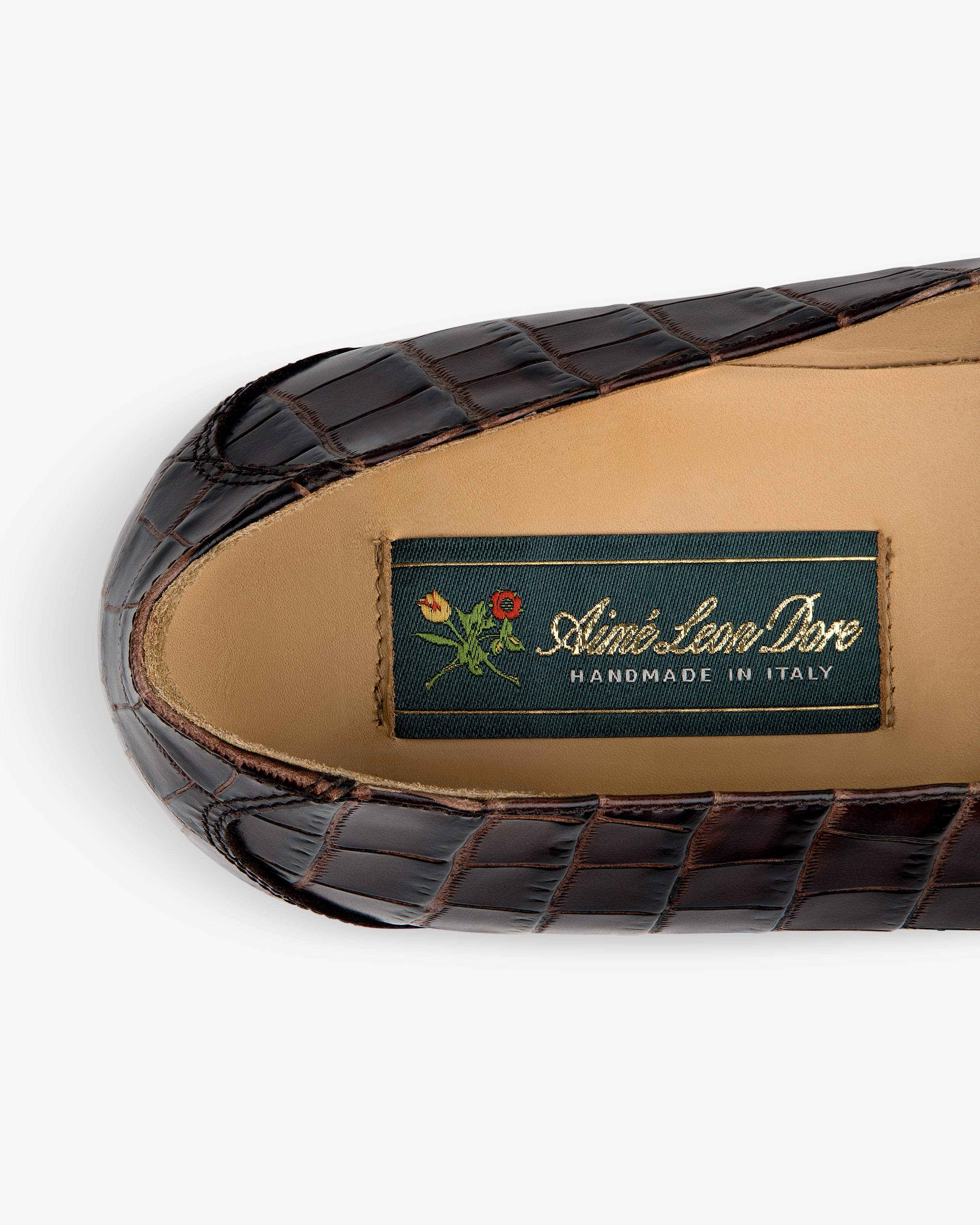 Venetian Croc Buckle Loafer: brown croc-pattern leather, tan insole, green “Aimé Leon Dore Handmade in Italy” label.
