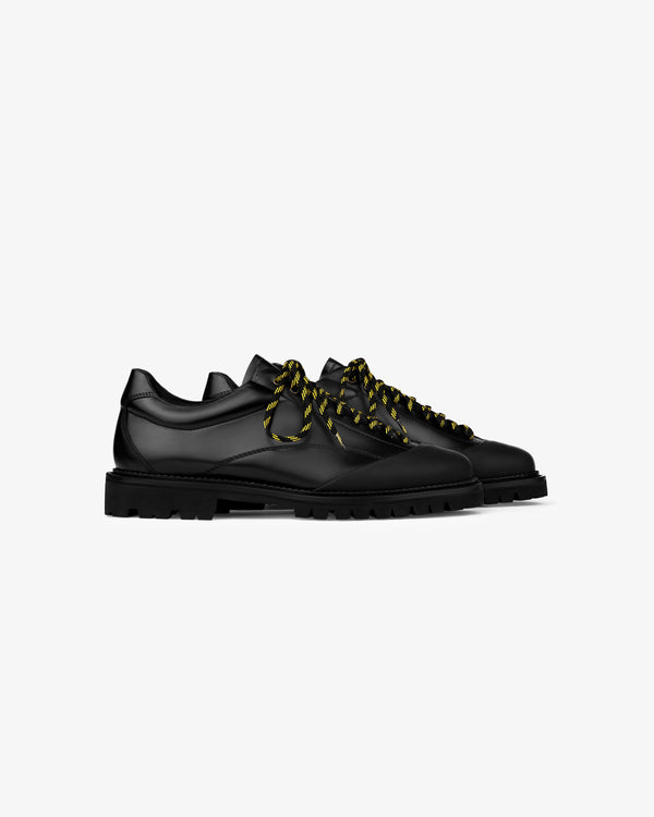 A pair of Leather Derby Hiker shoes with thick yellow-and-black striped laces on a white background.