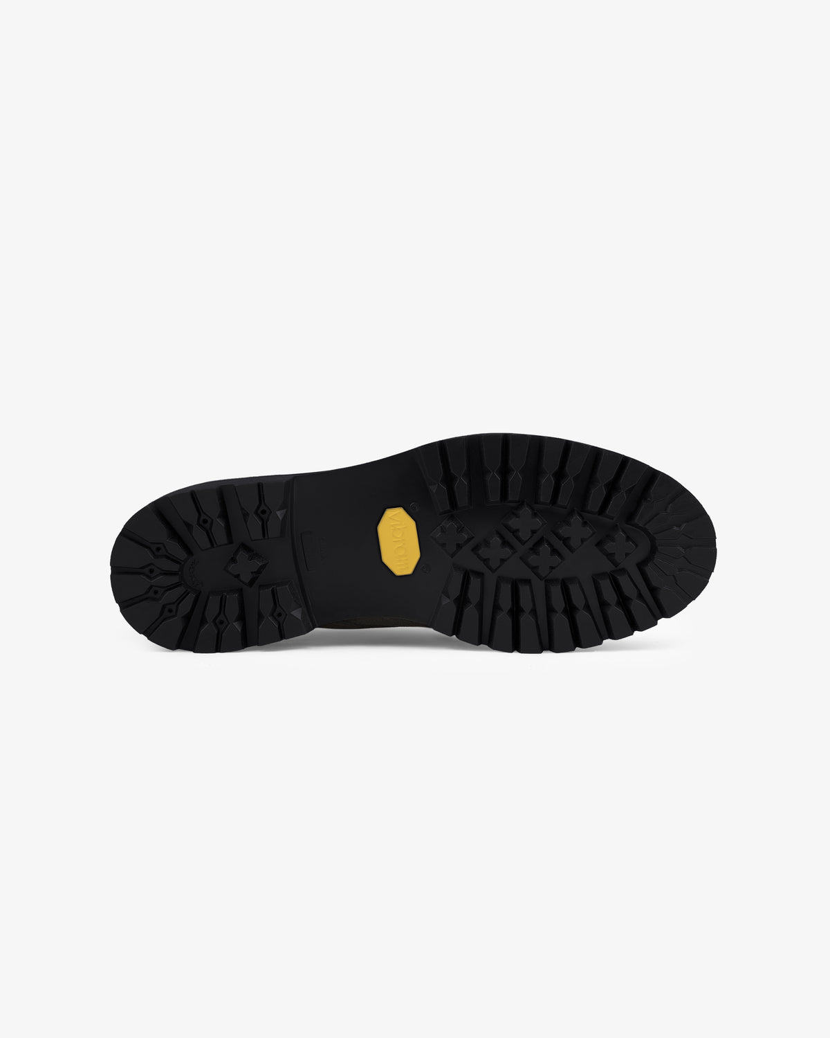 Suede Lug Sole Derby features a black rubber sole with rugged tread and a small yellow hexagonal center logo.
