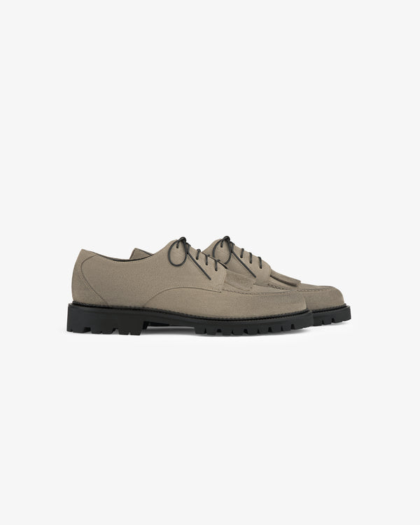 Suede Lug Sole Derby in taupe with black soles, lace-up style, shown on a white background.