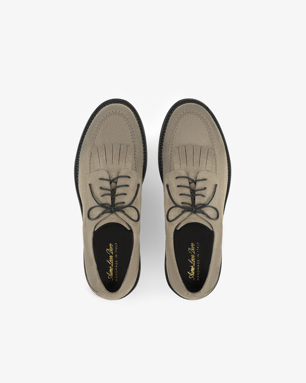 Top view of Suede Lug Sole Derby shoes in light brown, with black laces and soles, on a white background.