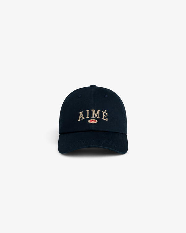 Aimé Souvenir Hat: Navy cap with AIMÉ NYC embroidered in beige and red on the front.
