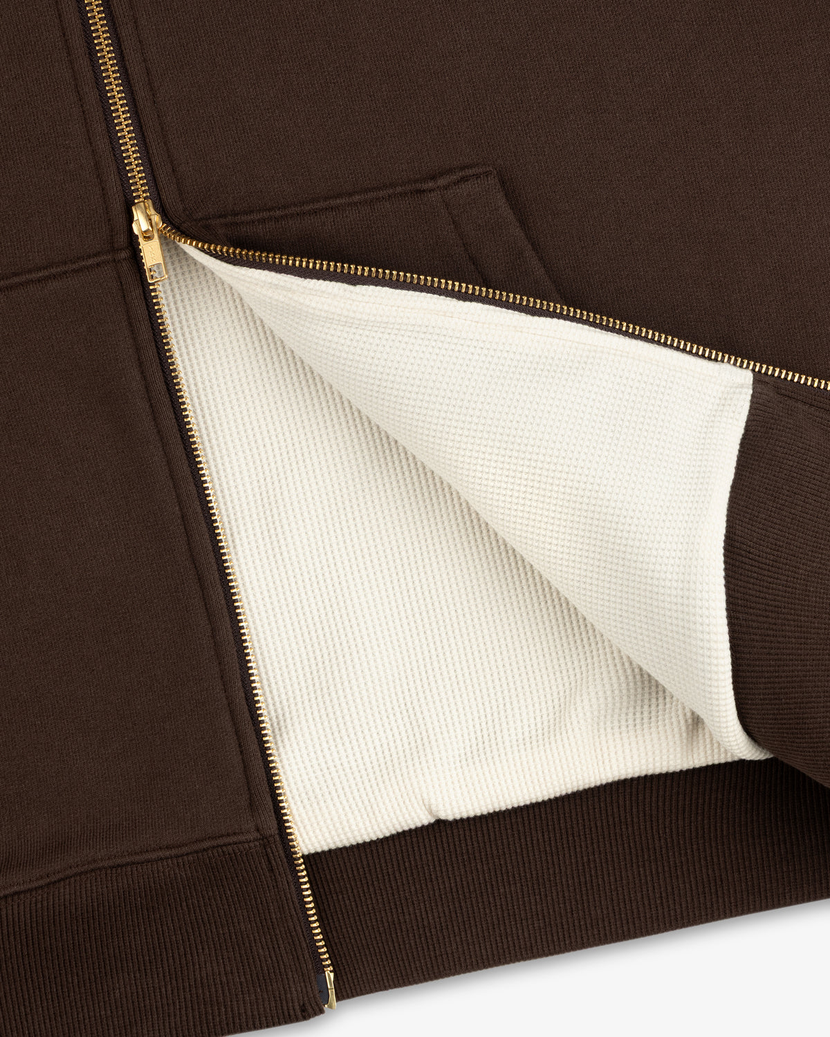 Unisphere Waffle Lined Full-Zip Hoodie in brown, partially unzipped to show the textured white lining and gold zipper.