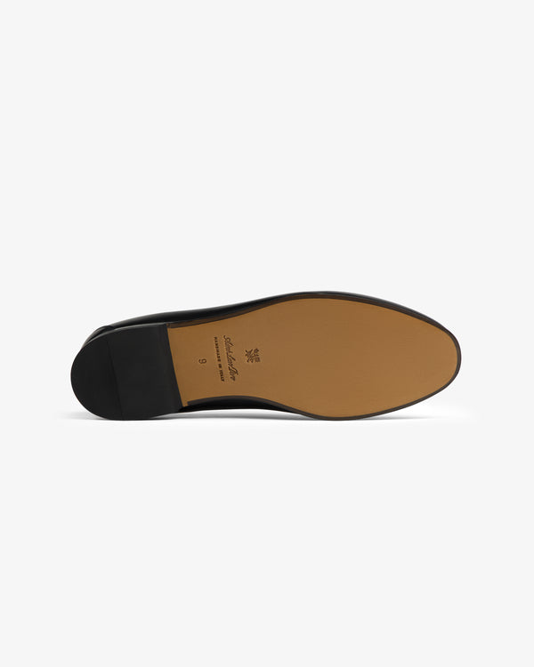 The Crest Salóni Loafer’s black sole features a tan bottom with the brand logo and size printed at the center.