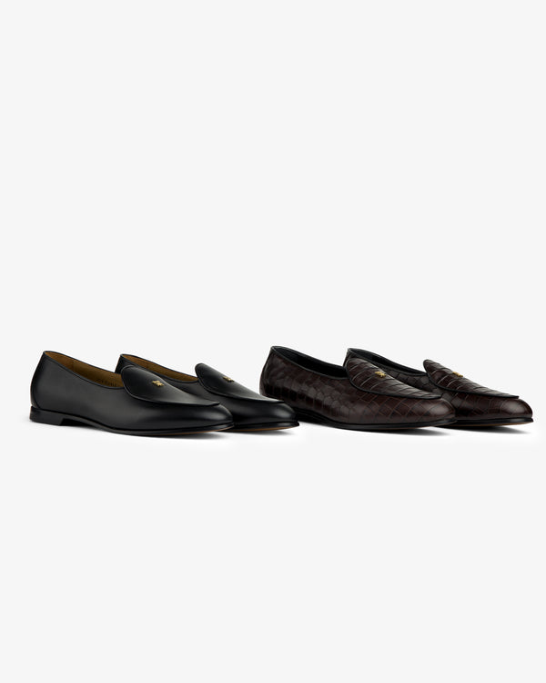 Two Croc-Embossed Crest Salóni Loafers, black leather and dark brown quilted, displayed on a white background.