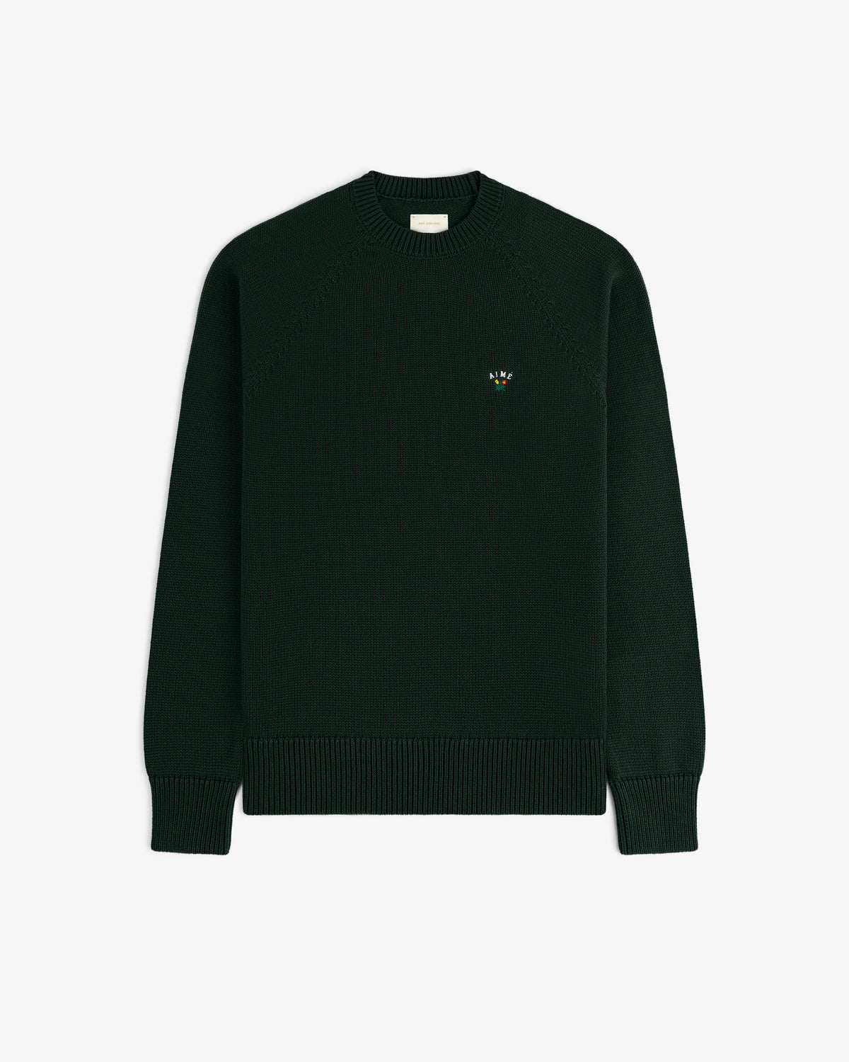 Crest Raglan Sweater: dark green knit with ribbed cuffs, hem, and a small colorful logo on the left chest.