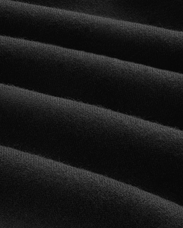 Close-up of Pavilion Cashmere Sweatpant: soft black fabric with even horizontal ridges and a velvety texture.