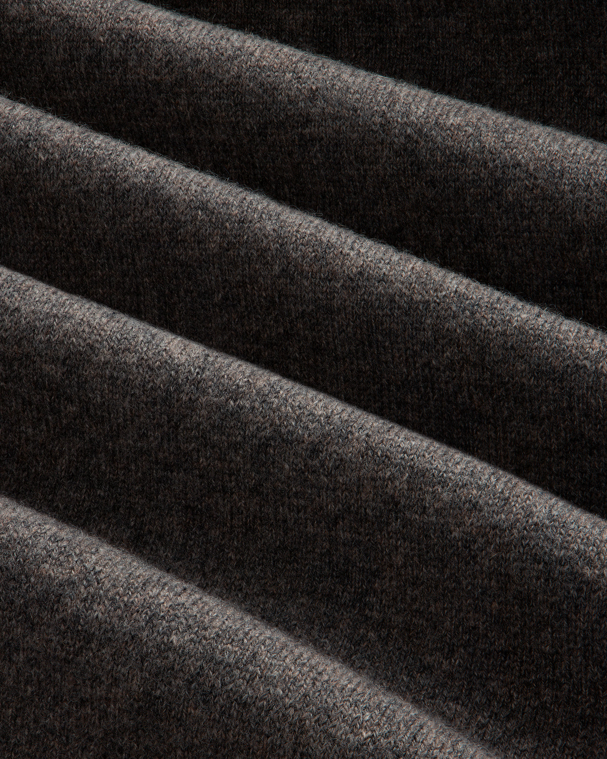 Close-up of the Full-Zip Pavilion Cashmere Hoodie in dark brown, showing its soft texture and even horizontal folds.