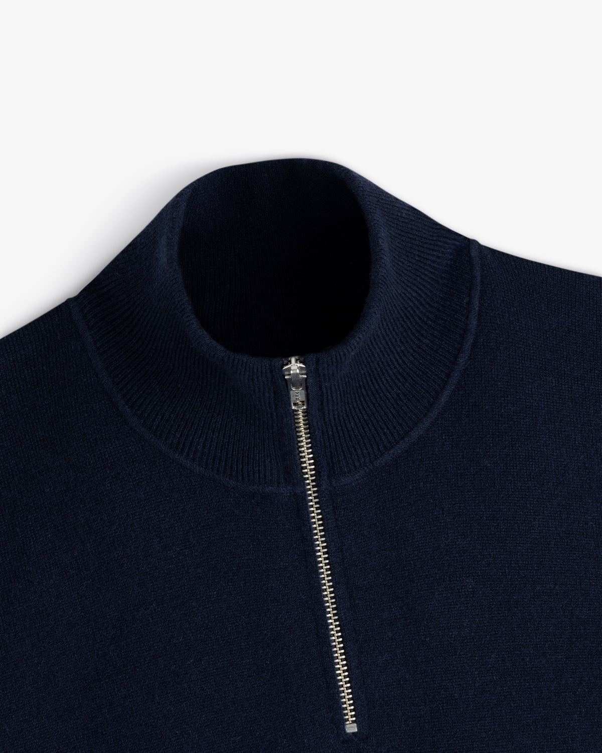 Quarter Zip Pavilion Cashmere Pullover in navy blue with silver half-zip and ribbed high collar, on white background.