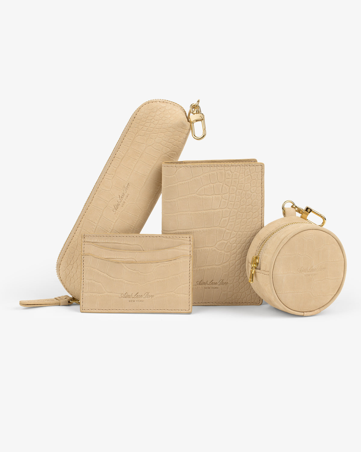 Croc-Embossed Nubuck Cardholder in beige with gold zipper and clasp, shown on a white background.