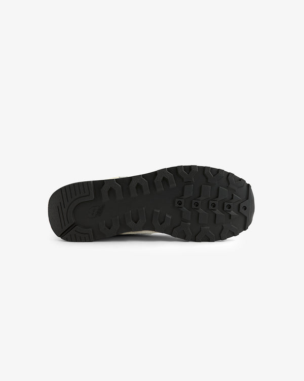 The ALD / New Balance 475 features a black rubber sole with rugged, textured tread, shown on a white background.