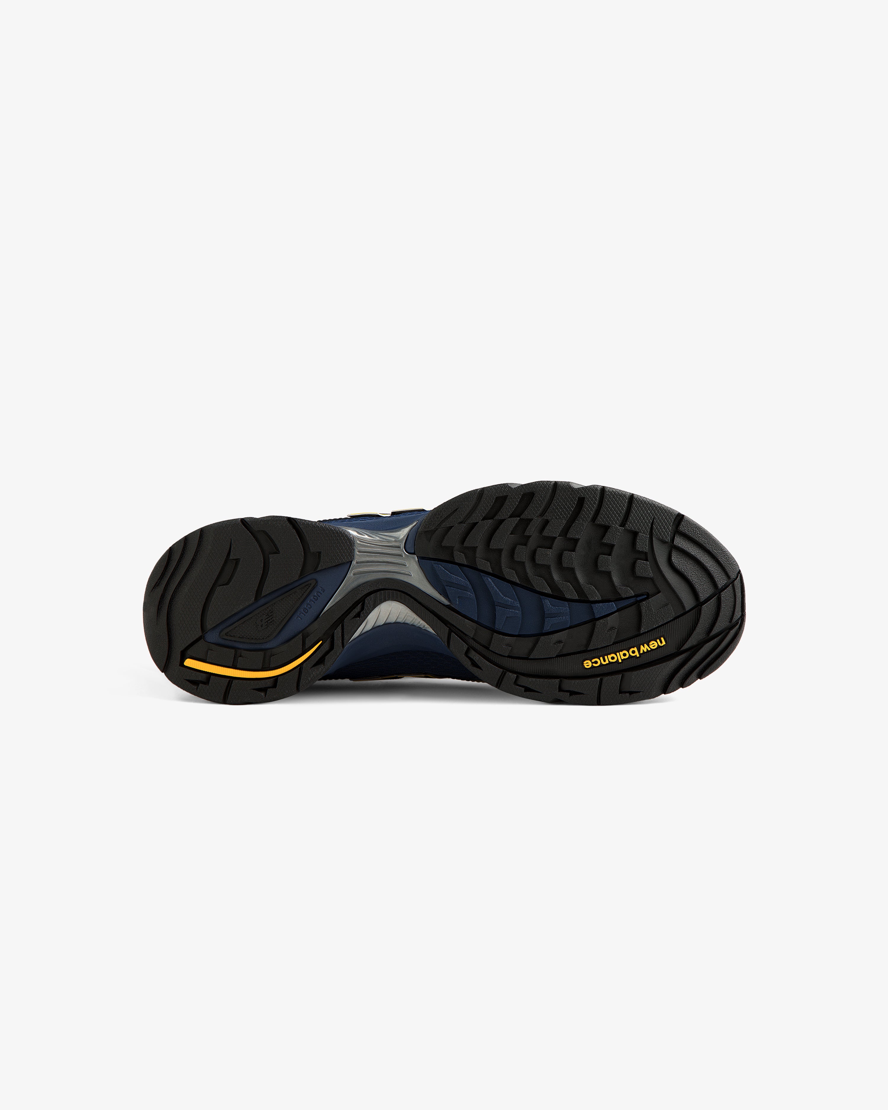 The image shows the black and navy sole of the ALD / New Balance RC56 sneaker with a yellow logo on white.