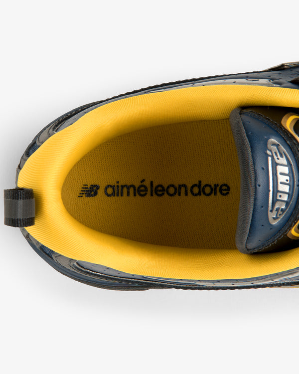 Top view of ALD / New Balance RC56 sneaker with yellow lining and co-branded insole logos.