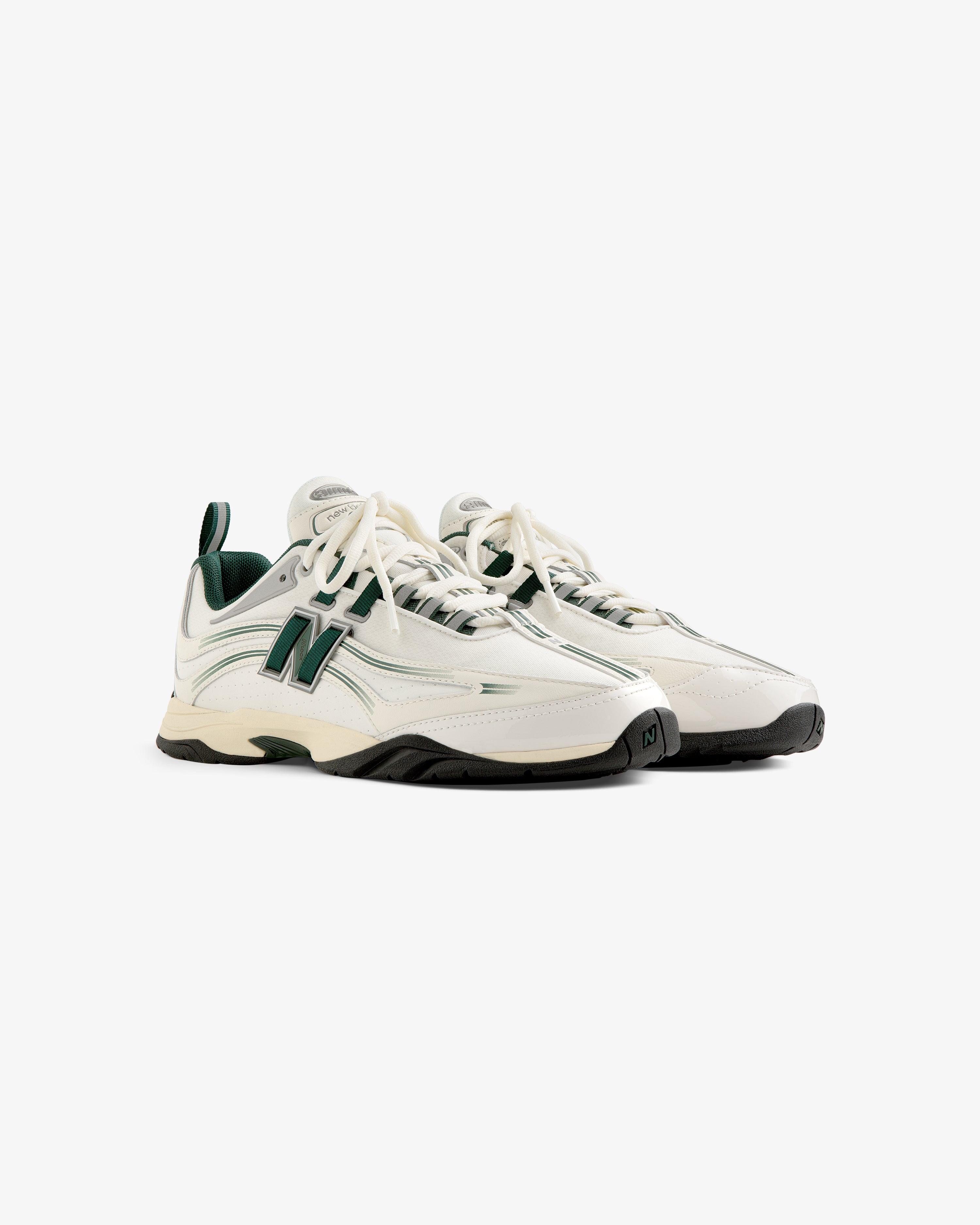 ALD / New Balance RC56 sneakers in white and green with chunky soles, shown at an angle on a white background.