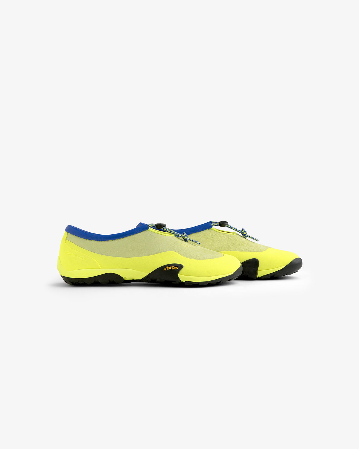 A pair of ALD / New Balance MT10T Sport Shoes in yellow with black soles, blue trim, and gray drawstring laces.