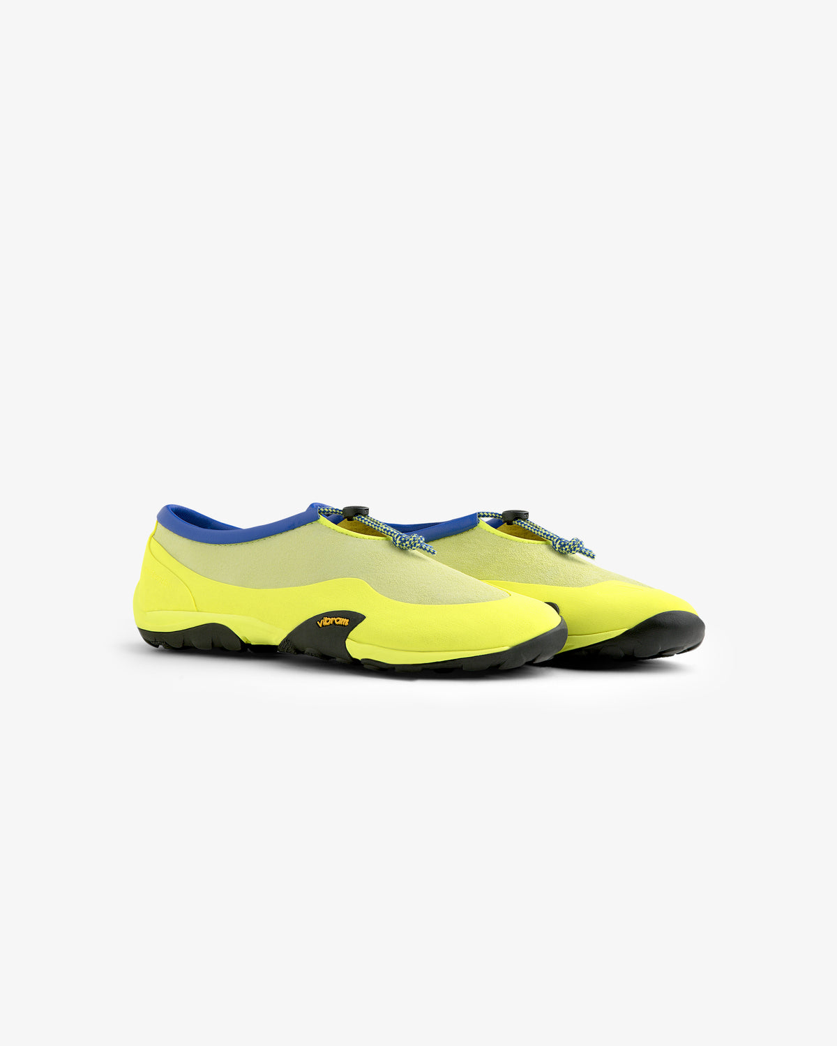 ALD / New Balance MT10T Sport Shoe: yellow slip-on with blue trim, black soles, on a white background.