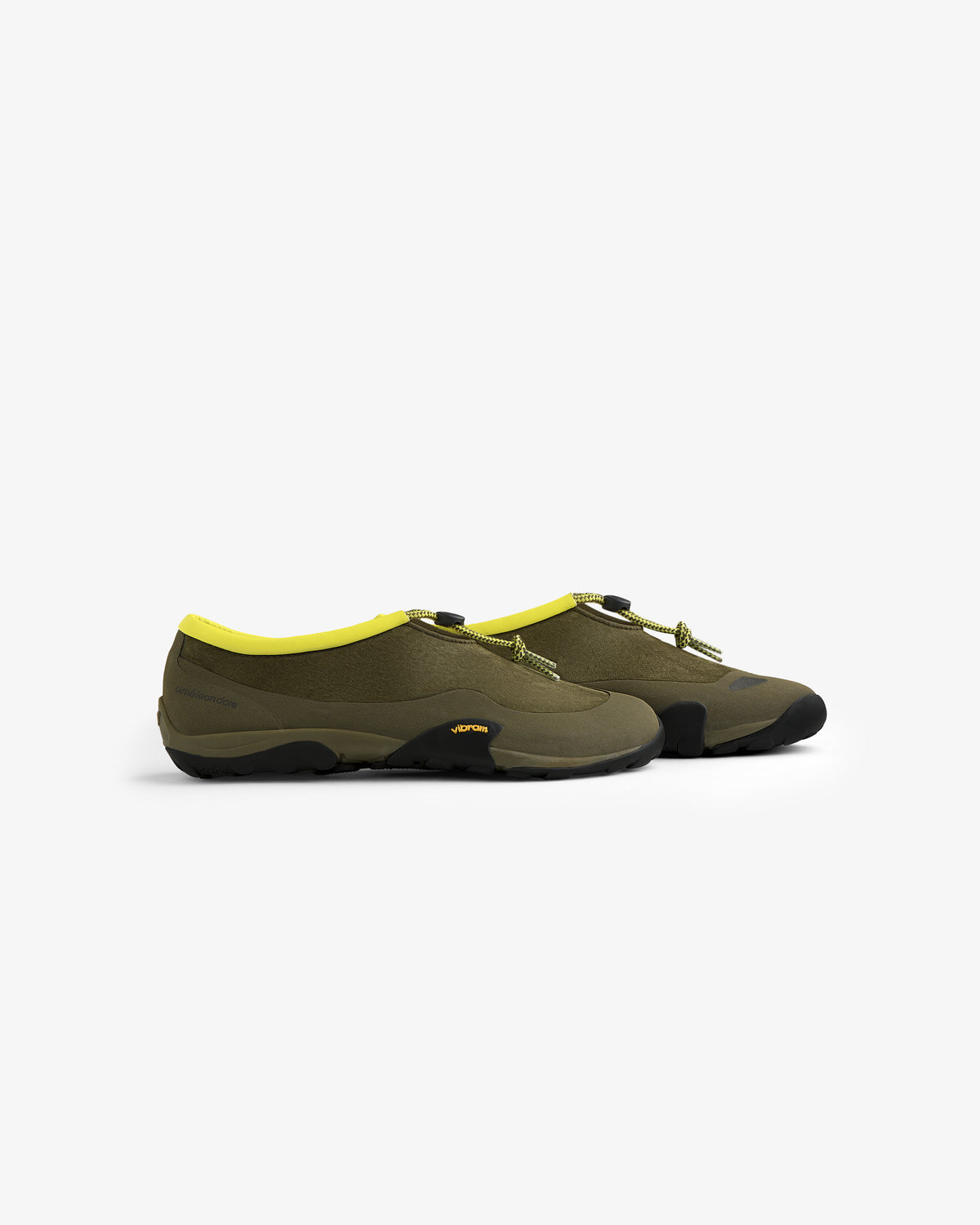 ALD / New Balance MT10T olive green slip-on shoes with black soles and yellow trim, side view on white.