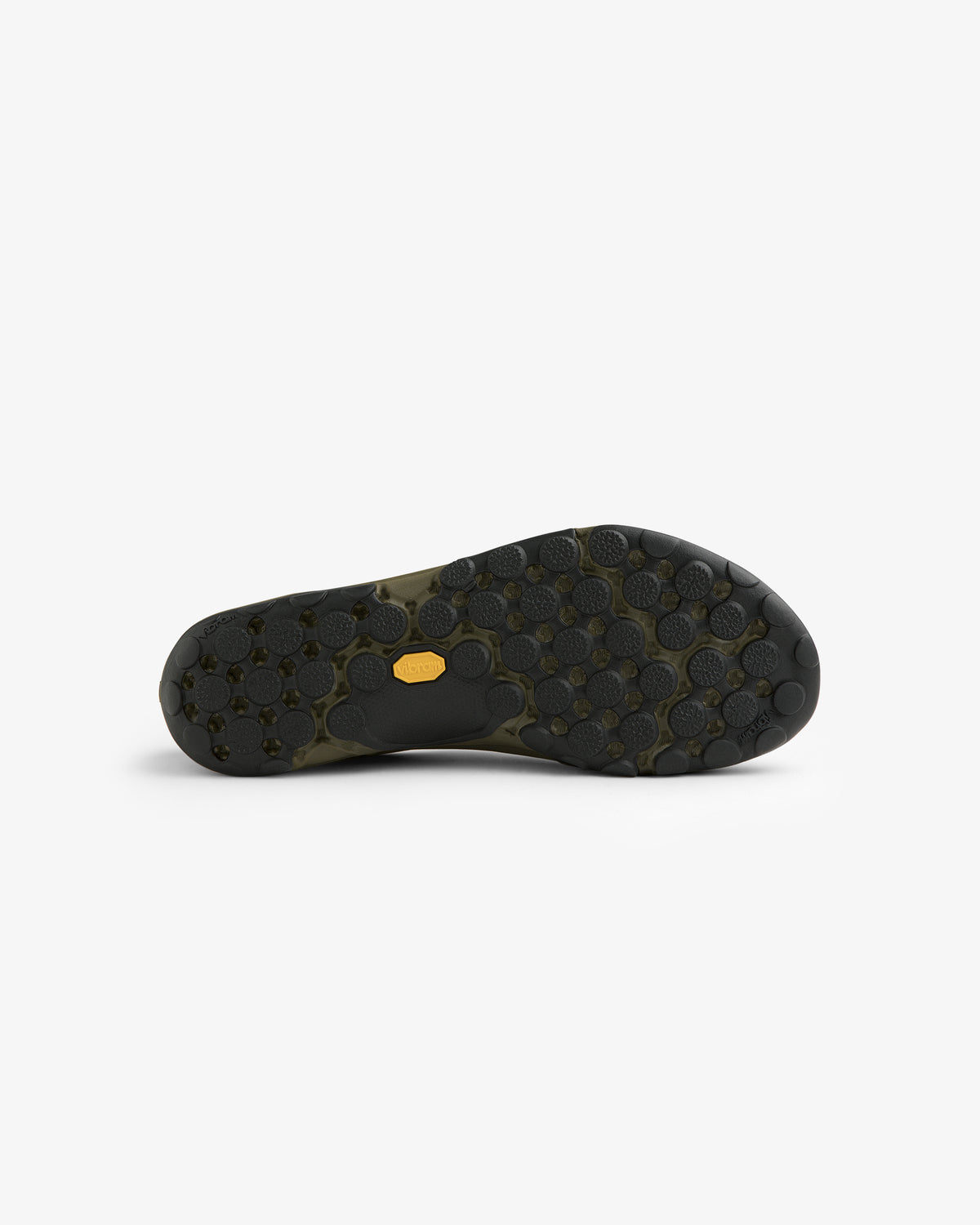 ALD / New Balance MT10T Sport Shoe features a black sole with circular traction and a small yellow logo in the center.