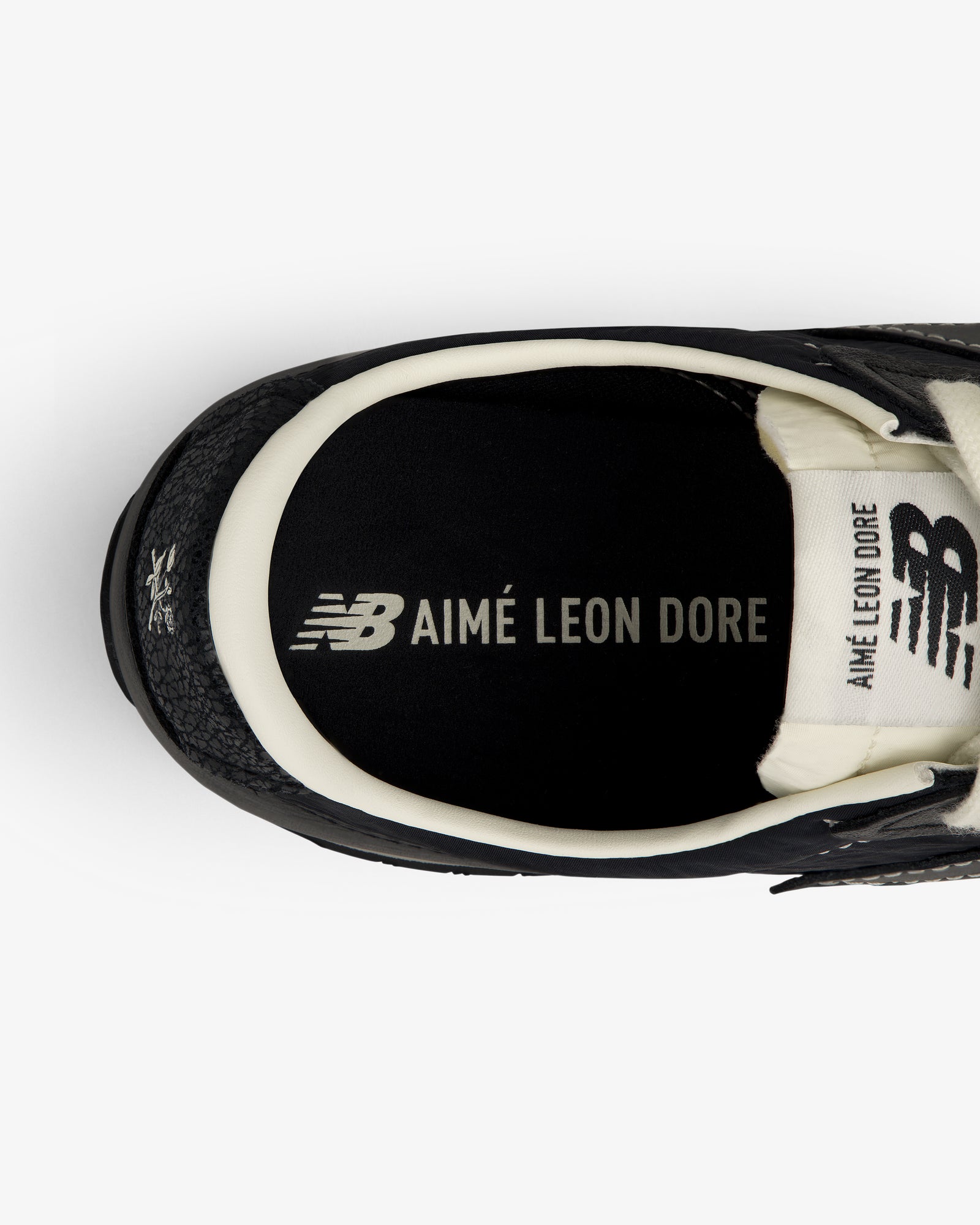 Top view of a black ALD / New Balance 471 sneaker with AIMÉ LEON DORE branding on the insole.