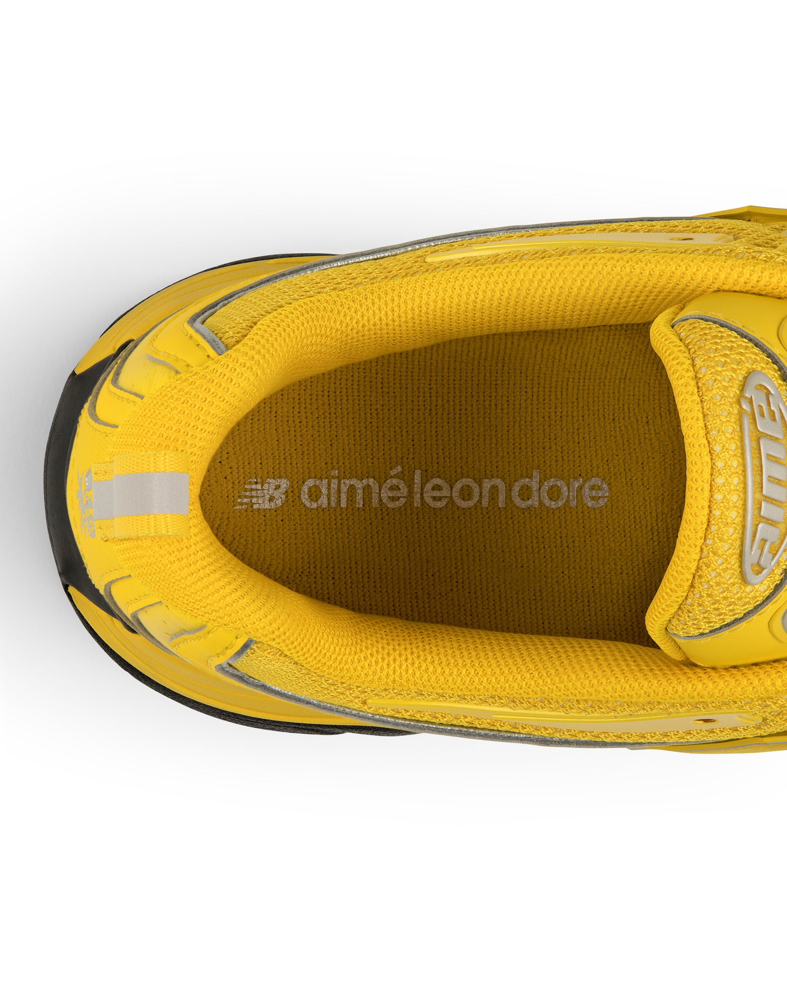 Top view of the yellow ALD / New Balance RC56 sneaker with aimé leon dore branding on the insole.