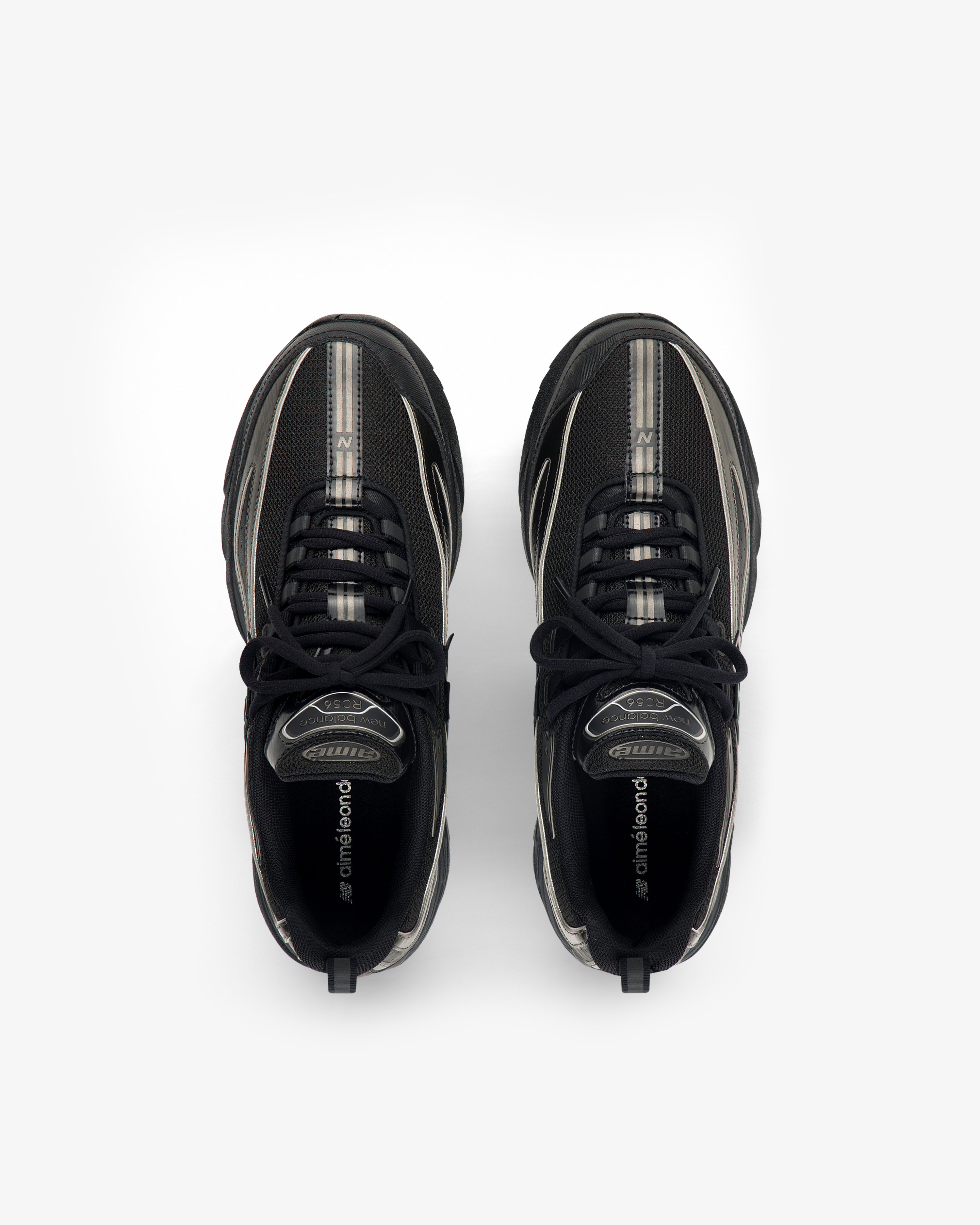 ALD / New Balance RC56 black and gray lace-up athletic shoes, top view on a white background.