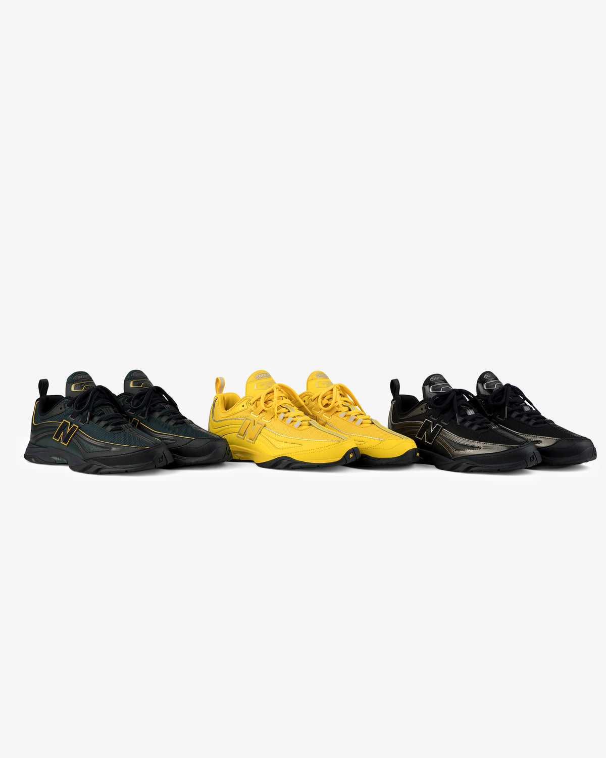 Three pairs of ALD / New Balance RC56 sneakers in black, yellow, and black-beige, side by side on a white background.