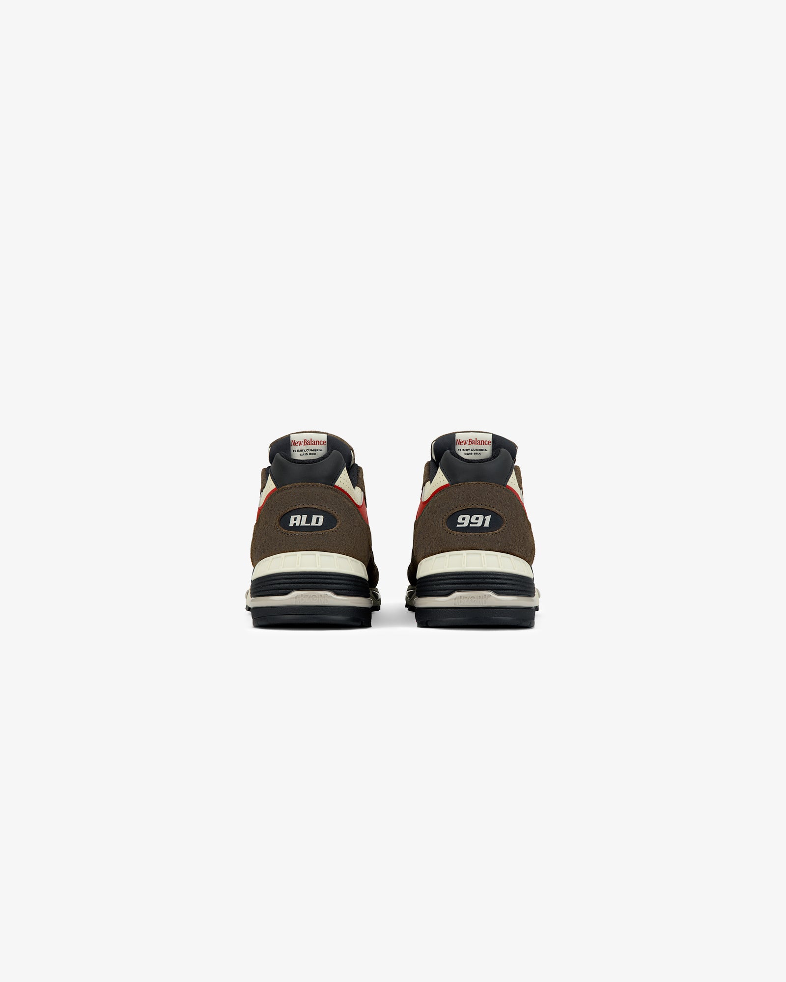 Rear view of two brown ALD / New Balance Made in UK 991 sneakers with “ALD” and “991” on the heels.