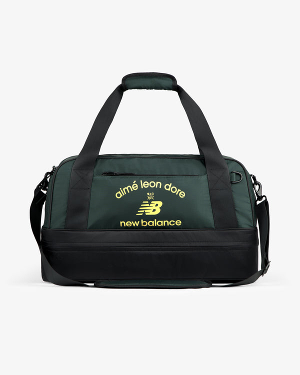 Dark green ALD / New Balance Travel Duffle Bag with black straps and yellow logos on the front.
