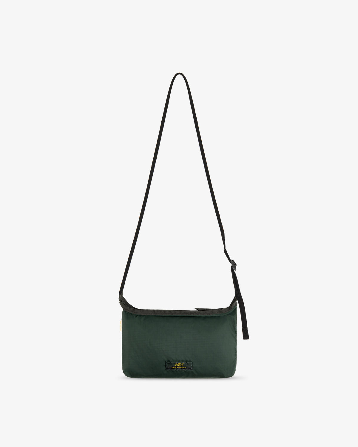 ALD / New Balance Nylon Sling Pouch, dark green with a long black strap and small front logo on white background.