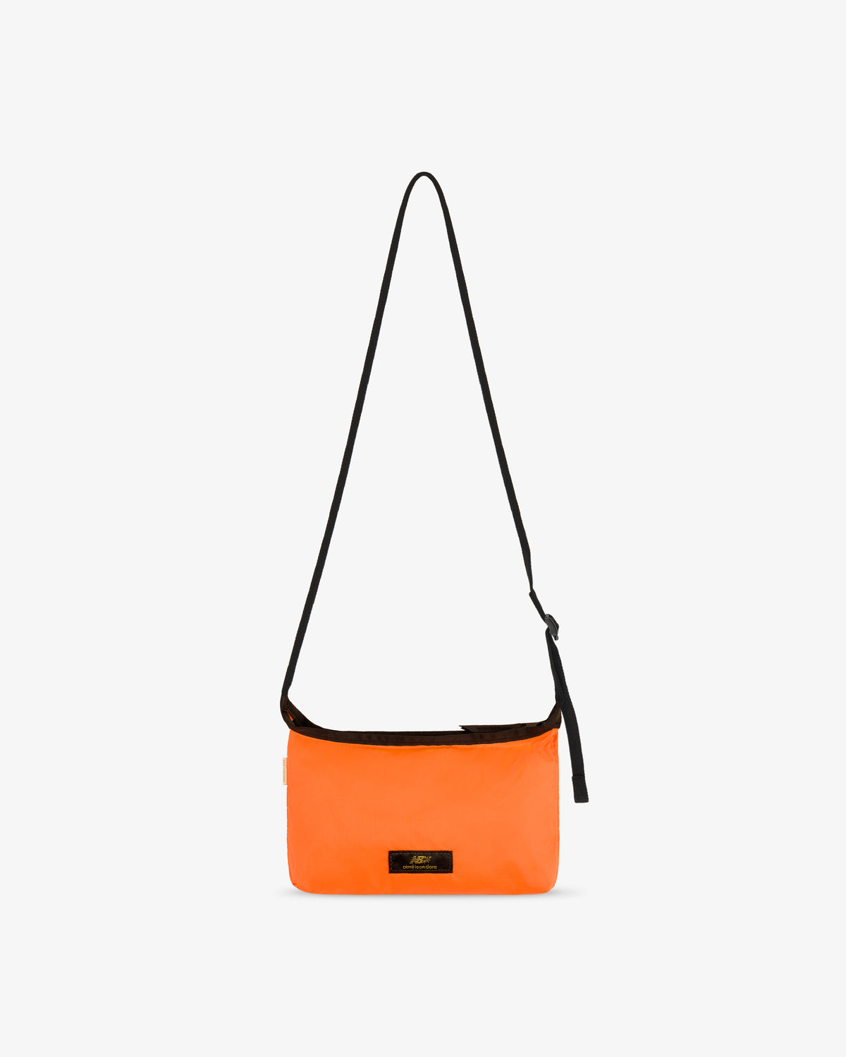 ALD / New Balance Nylon Sling Pouch: bright orange, long black strap, small black front label on white background.