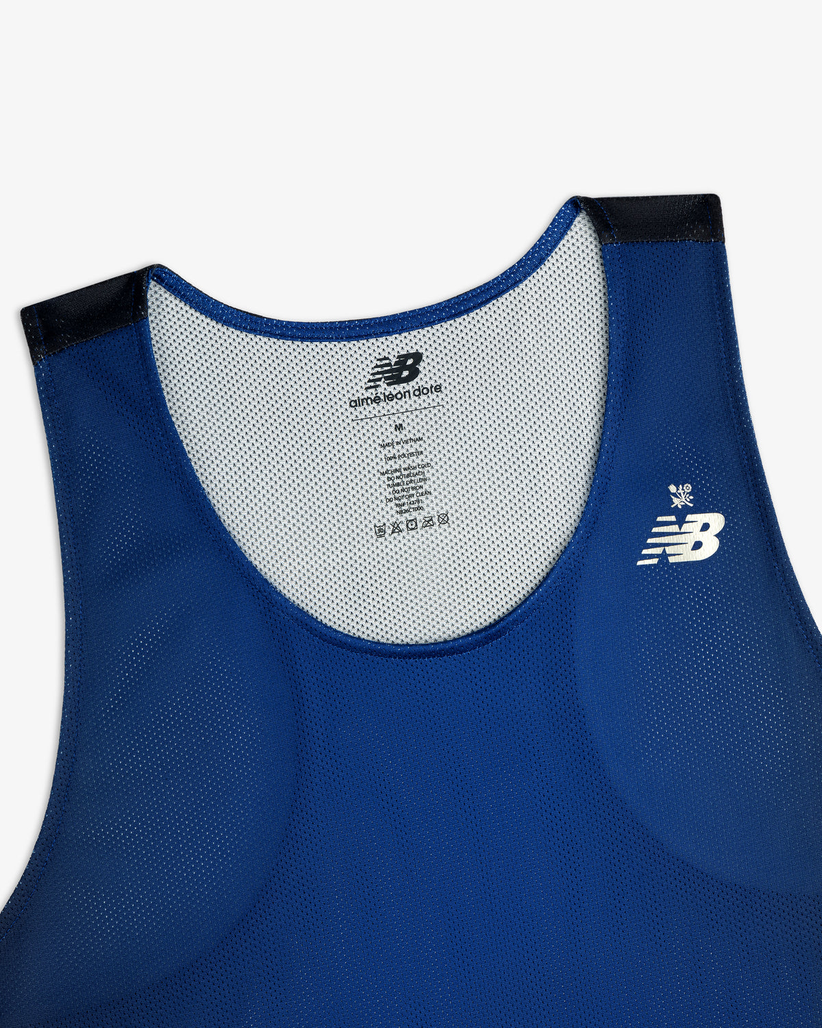 Blue ALD/New Balance Running Gradient Singlet with white logo and black shoulder accents, upper front view.
