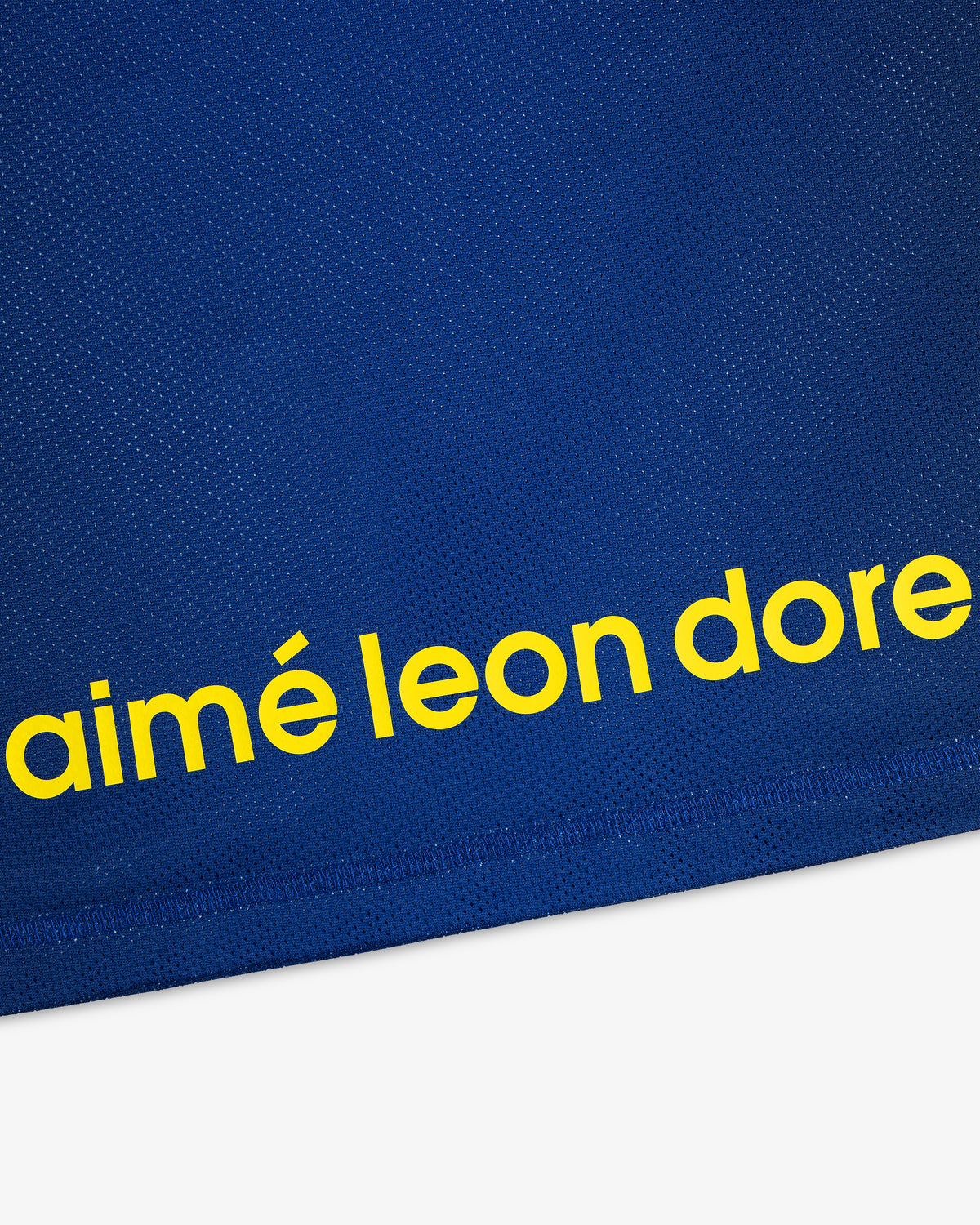 Blue ALD / New Balance Running Gradient Singlet with bold yellow “aimé leon dore” text near the hem.