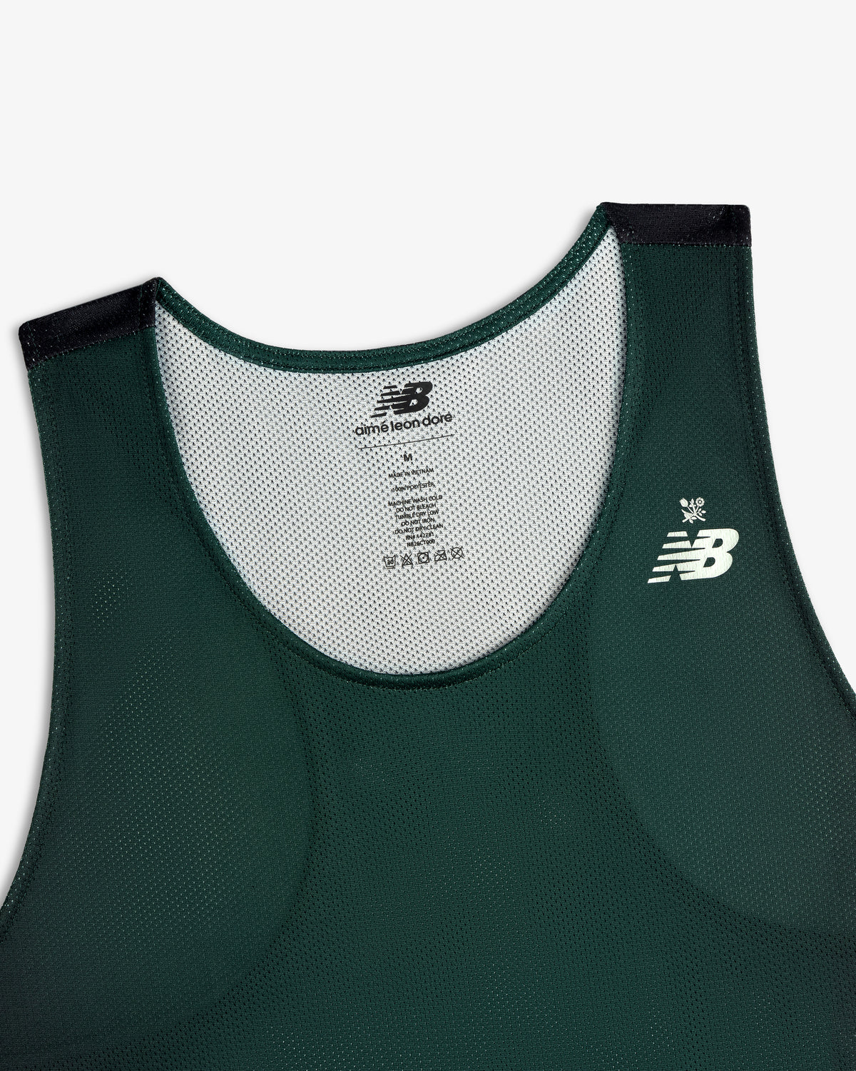 Front view of the ALD / New Balance Running Gradient Singlet in dark green with white logo and mesh detail.