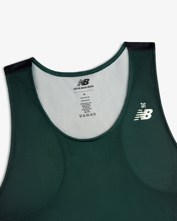 Front view of the ALD / New Balance Running Gradient Singlet in dark green with white logo and mesh detail.