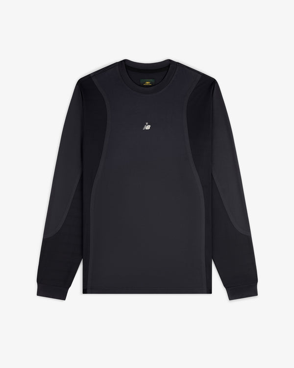 ALD / New Balance Performance Long-Sleeve Tee in black with subtle panels and white chest logo, shown on white background.