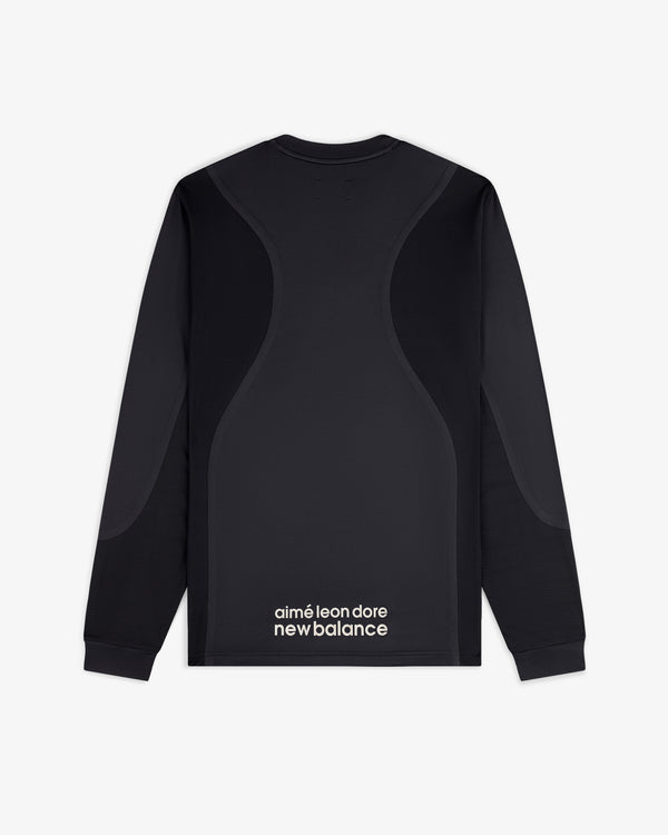 ALD / New Balance Performance Long-Sleeve Tee in black with curved seams and logo text at the lower back.