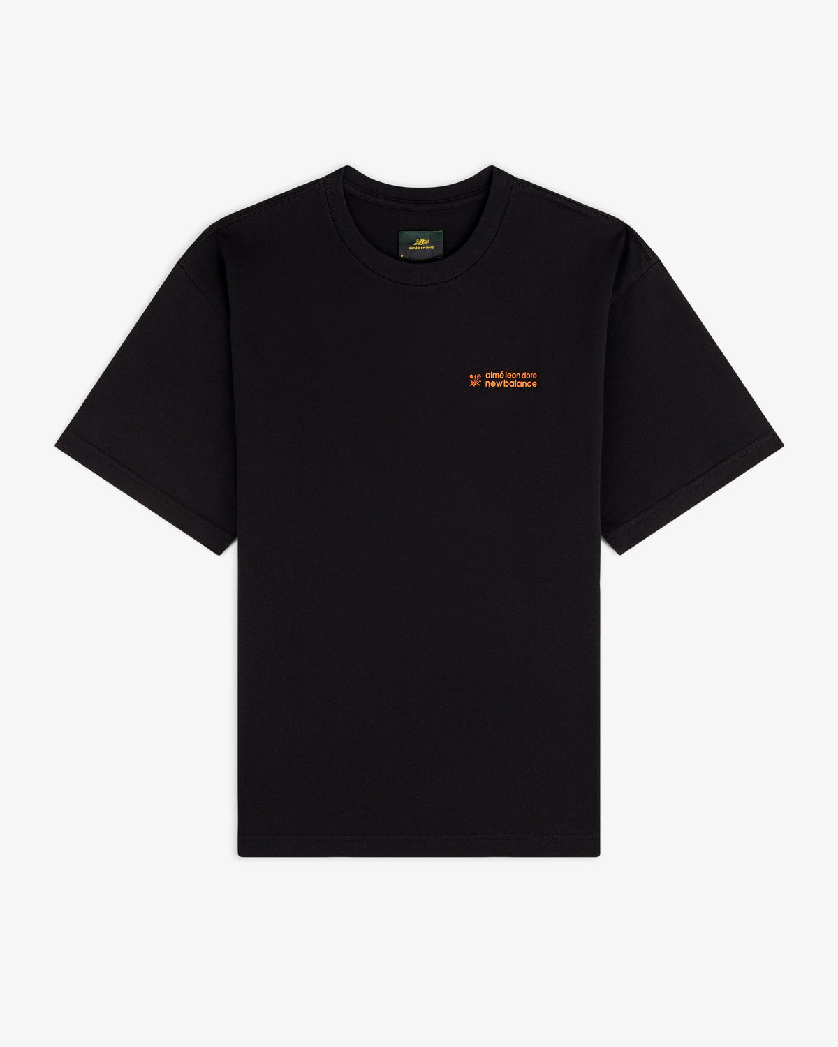 ALD / New Balance Running Bib Tee, black with small orange chest text, laid flat on a white background.