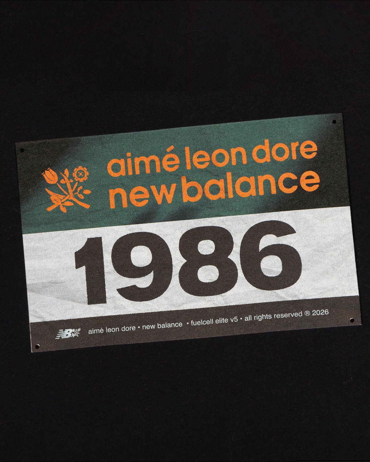 A label reads ALD / New Balance Running Bib Tee on a dark background with logos and copyright details.