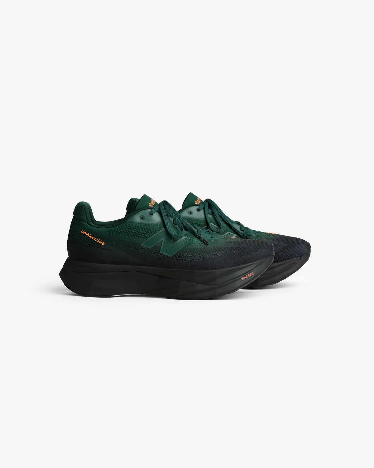 ALD / New Balance FuelCell SuperComp Elite v5 in dark green with black soles and orange accents on white background.