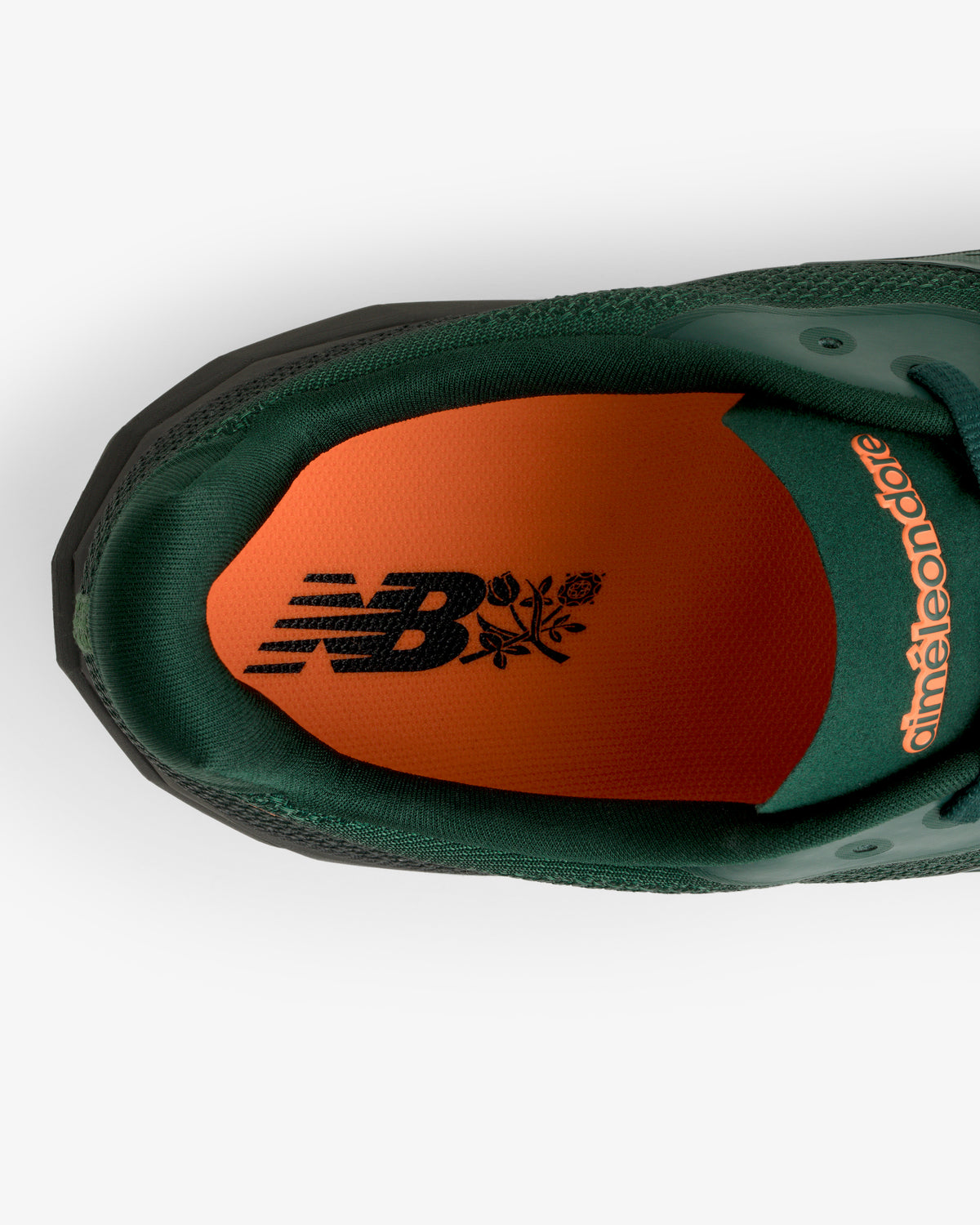 Top view of ALD / New Balance FuelCell SuperComp Elite v5: green sneaker, orange insole, black logos.