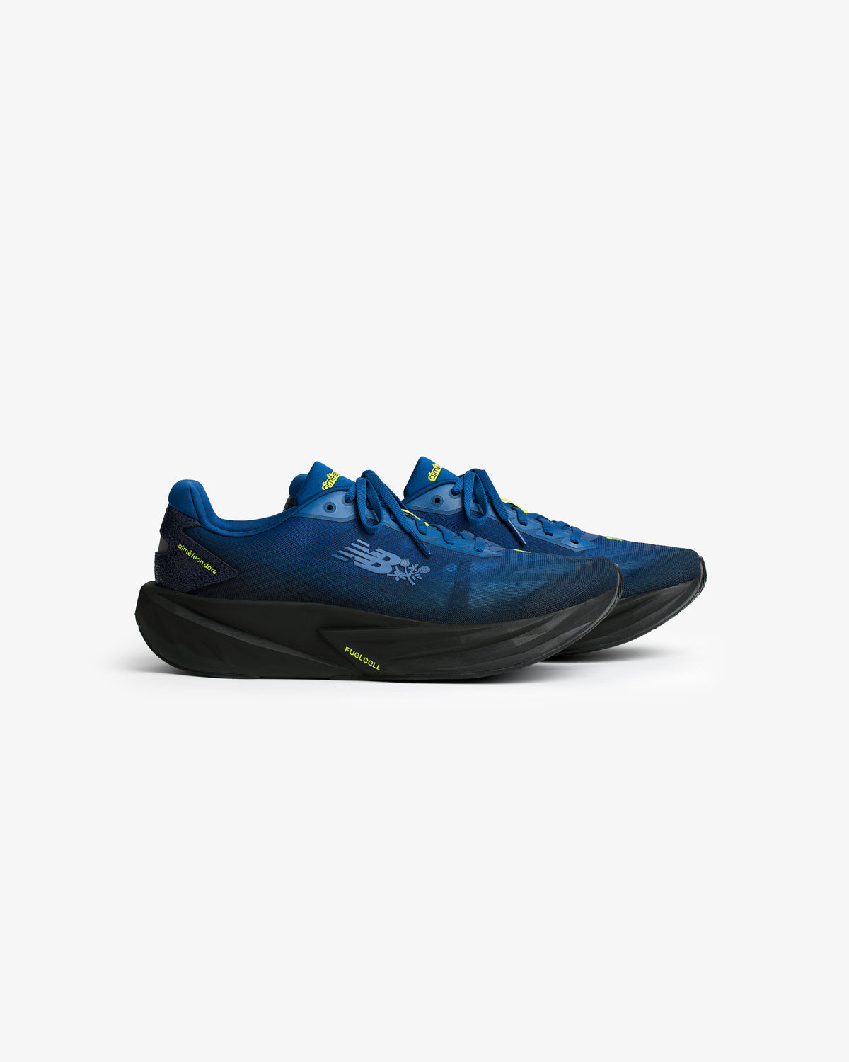 ALD / New Balance FuelCell Rebel v5 blue running shoes with black soles, side view, on a white background.