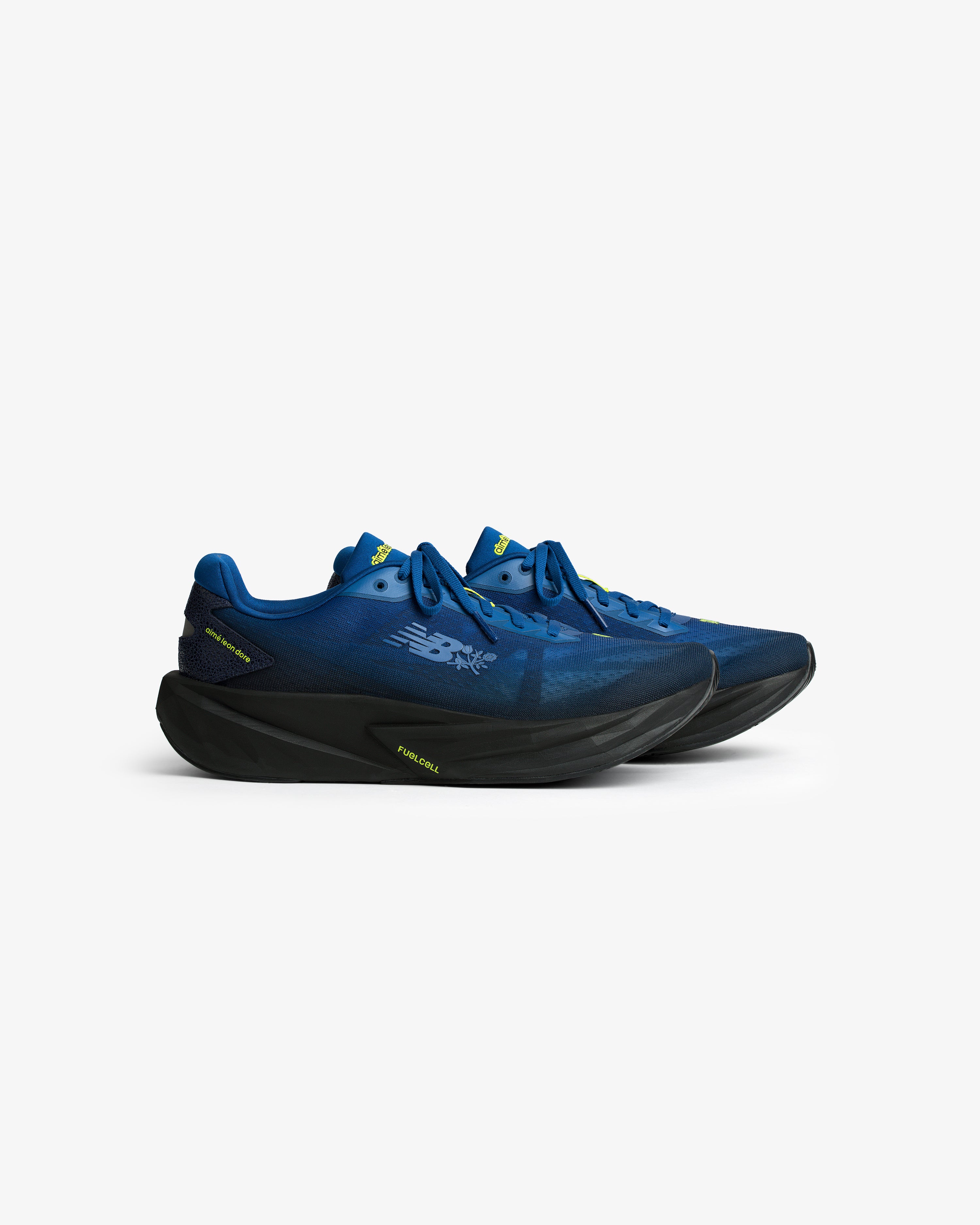 ALD / New Balance FuelCell Rebel v5 blue running shoes with black soles, side view, on a white background.