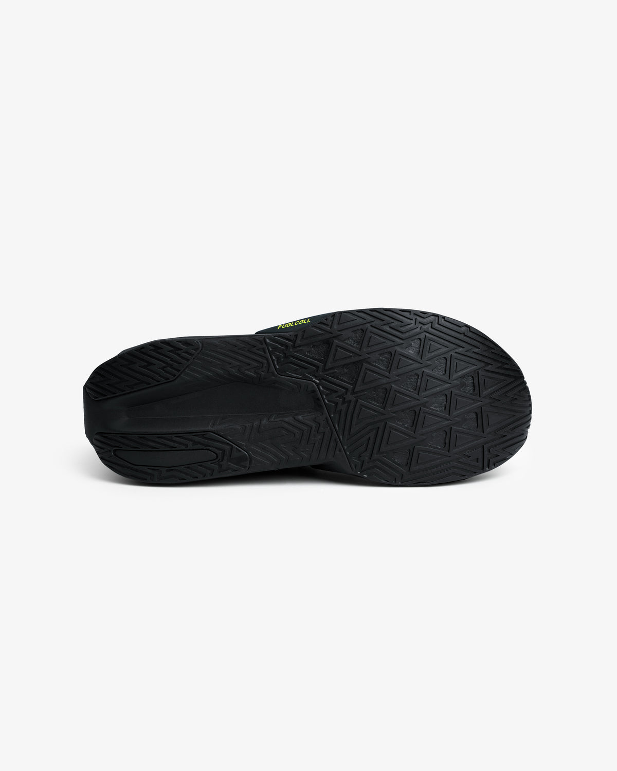 ALD / New Balance FuelCell Rebel v5 black rubber sole with geometric tread, shown from below on a white background.