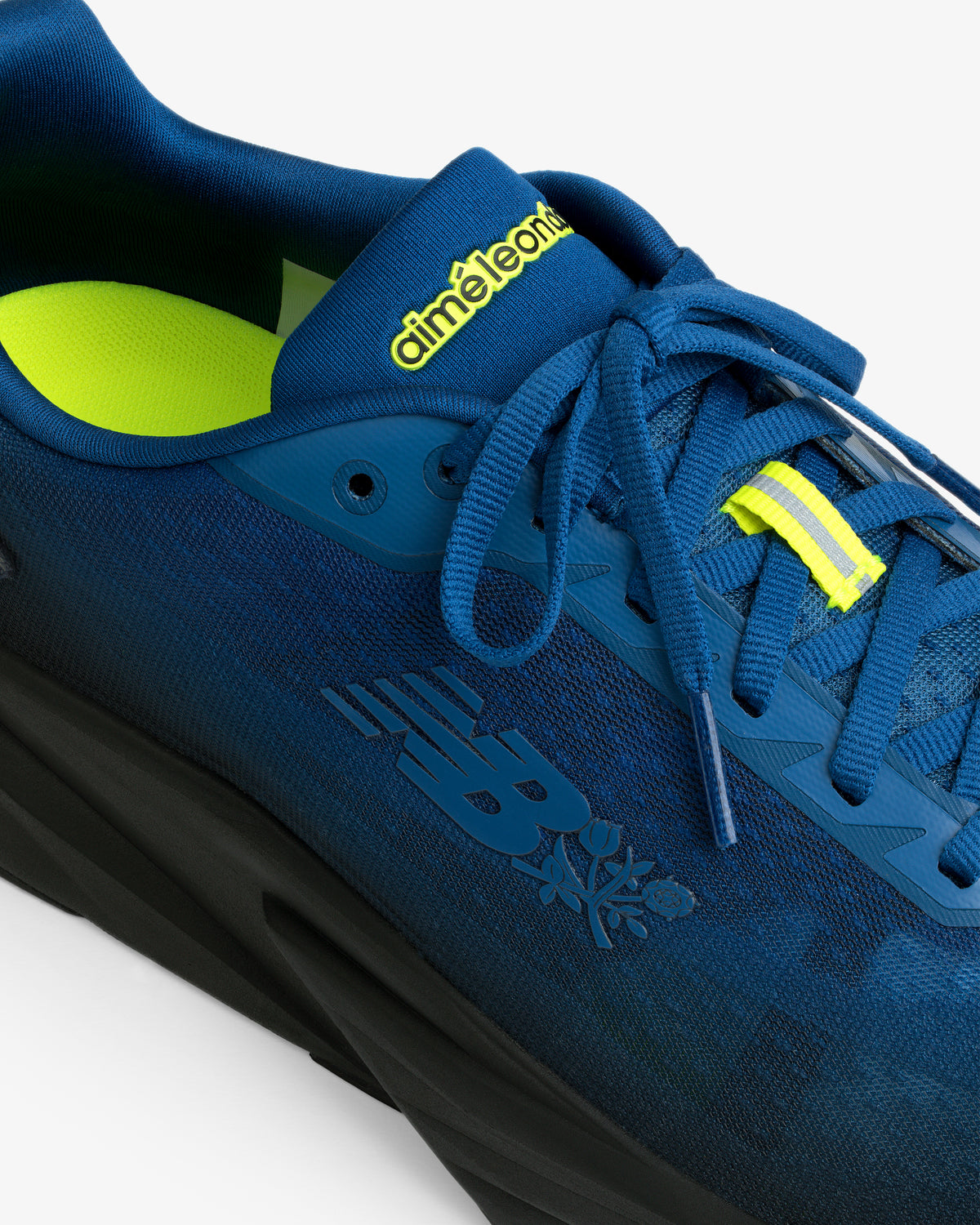 The ALD / New Balance FuelCell Rebel v5 is a blue sneaker with yellow accents and Aimé Leon Dore branding on the tongue.