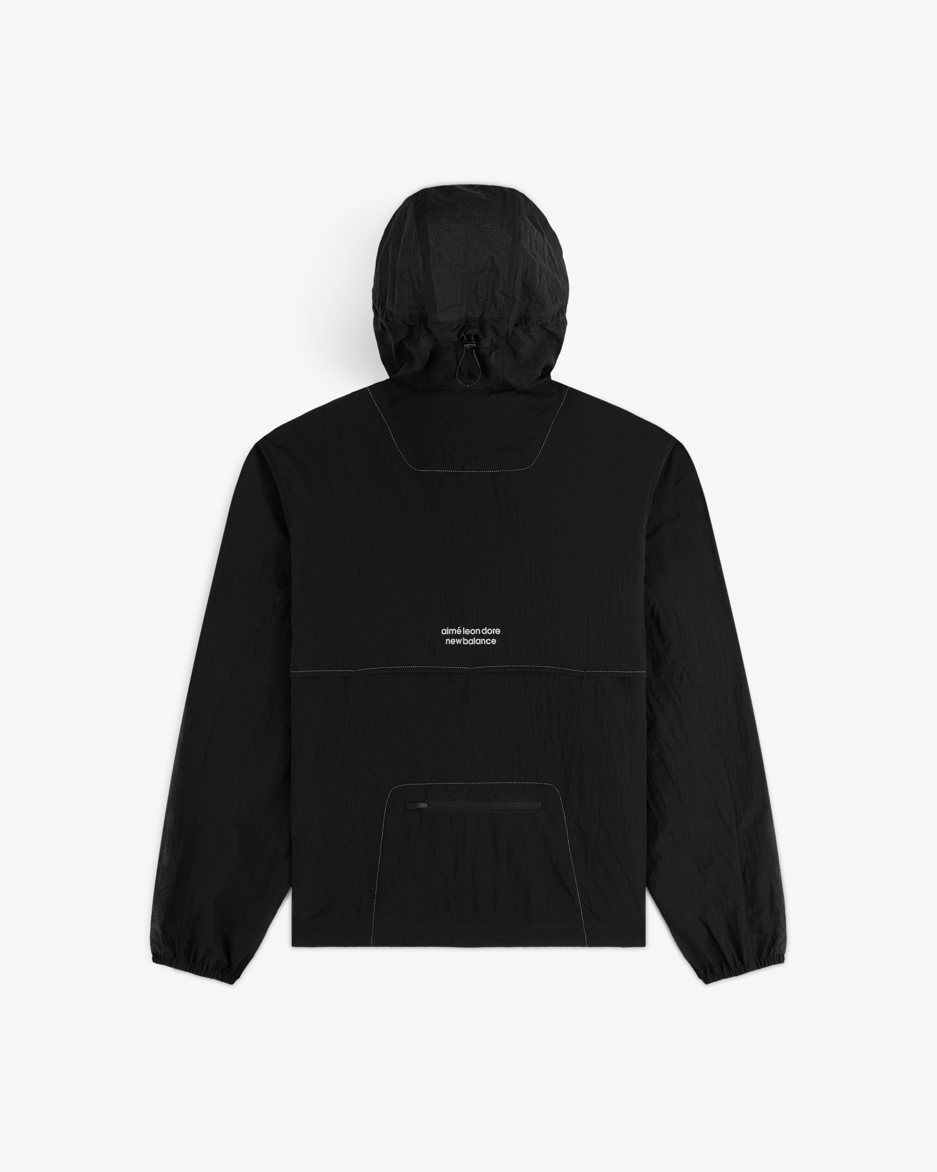 The ALD / New Balance Breathable Half-Zip Pullover is black with a front pocket and small white text on the back.