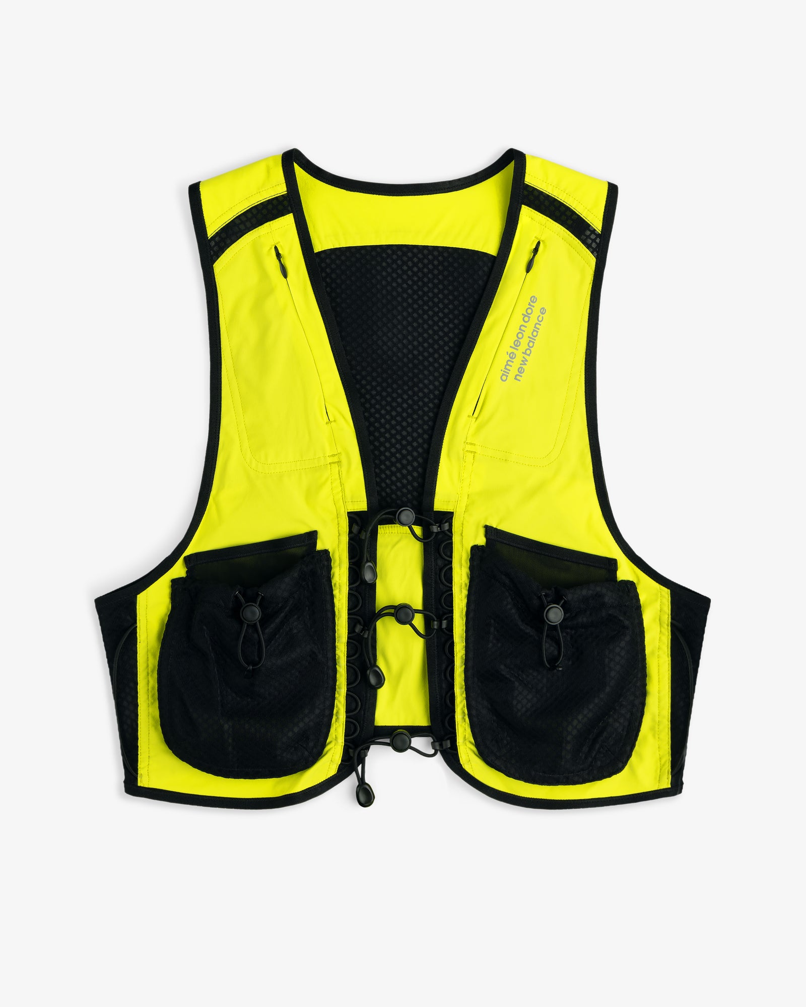 The ALD / New Balance Hydrovest is neon yellow with black trim and two large front pockets, shown on a white background.